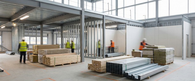 Commercial site delivery scene showing clean coordination and tidy materials staging