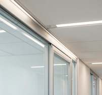 Ceiling and partition interface detail on a tidy fit-out