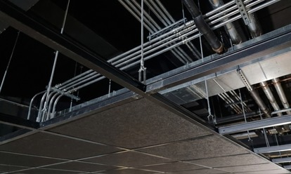 Ceiling grid installation detail with coordinated services