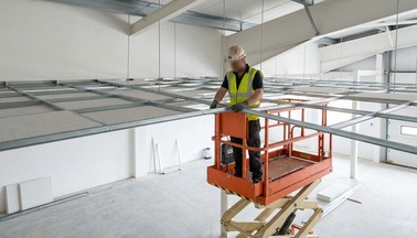 Suspended ceiling grid setting out on a commercial interior site